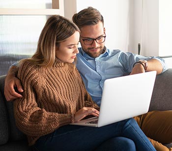 about-bioidentical-hormone-doctors-locator happy couple researching customized hormone pellet therapy online together